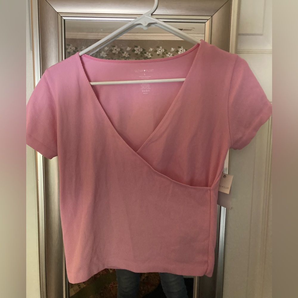 Cute pink top. Ribbed with stretch, size large